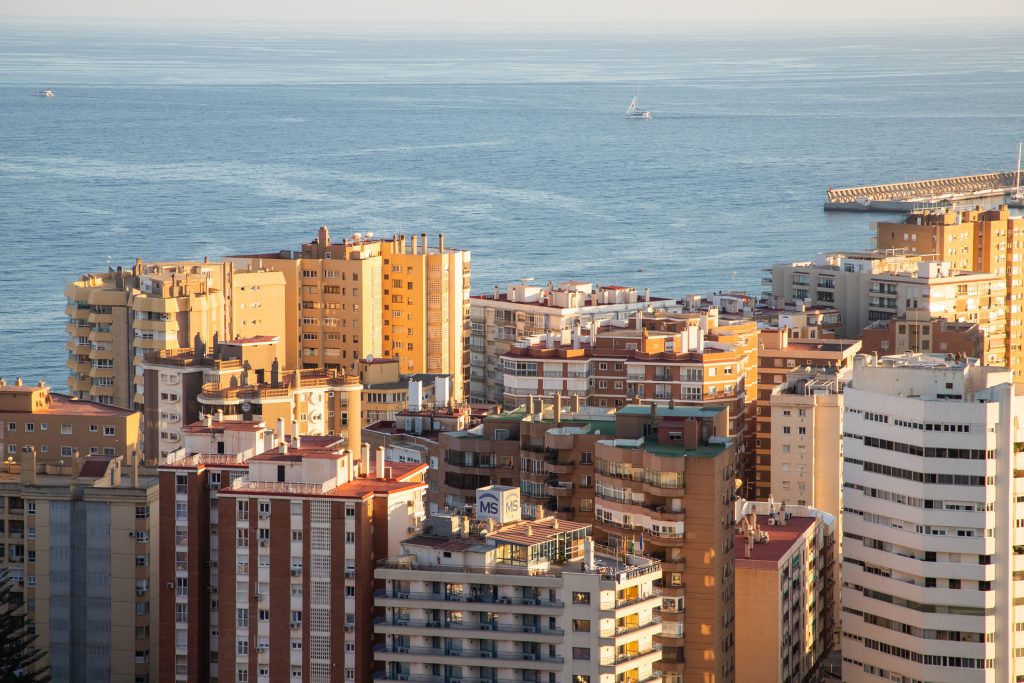 view over Malaga at sunset travel banner